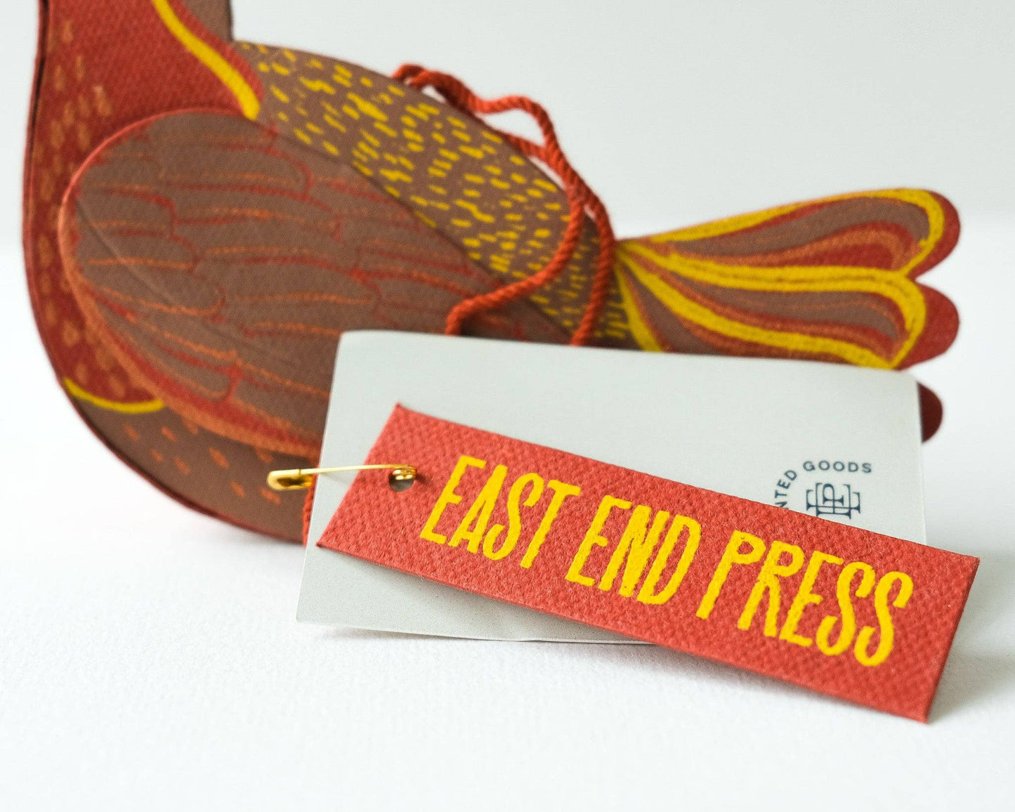 Sustainable robin ornament, front and back view of screen print