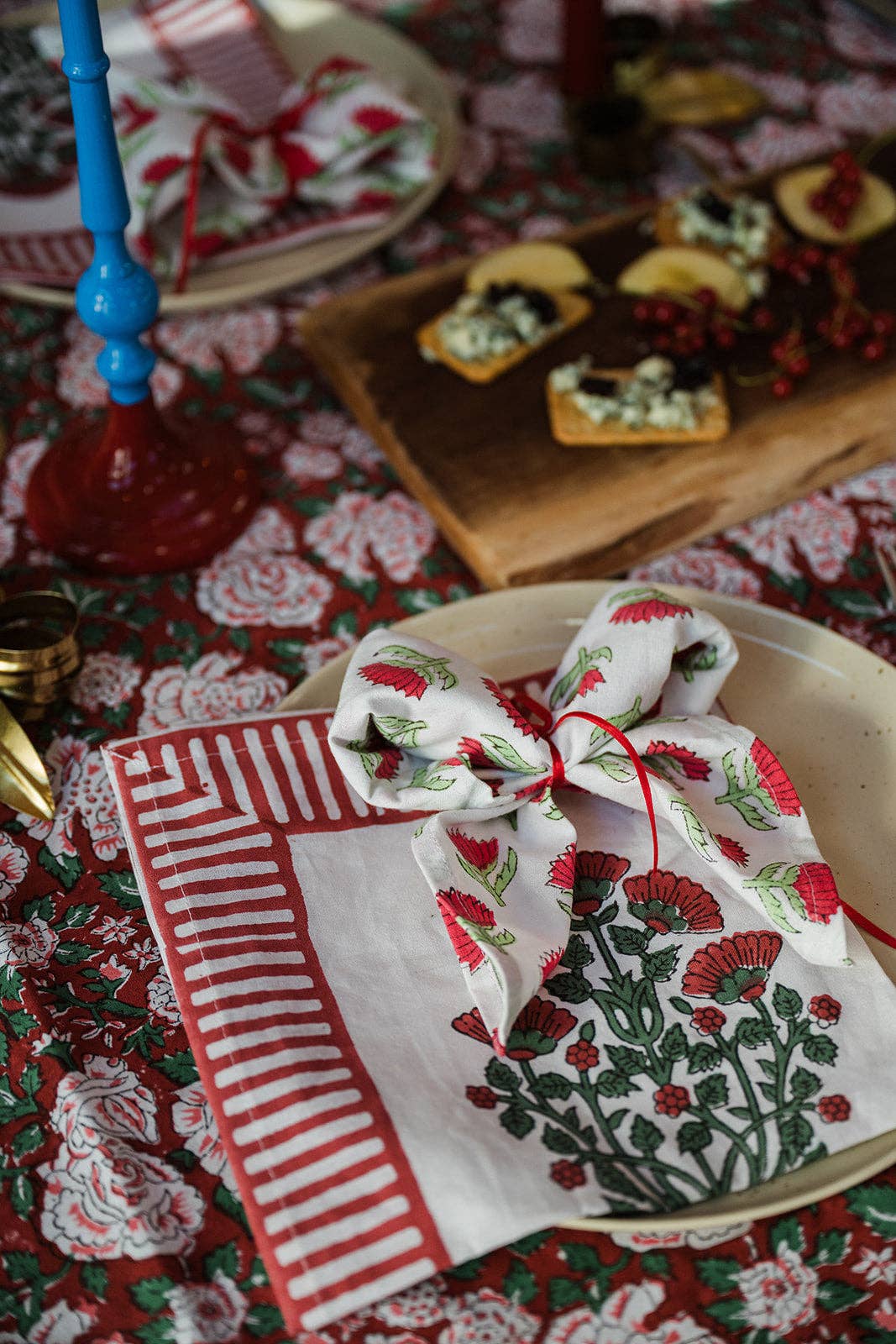 Close up of Winterberry cotton napkin showing intricate floral and berry block print details