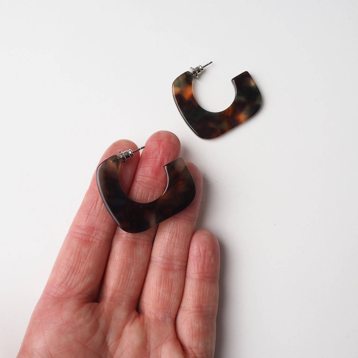 Hypoallergenic surgical steel post detail on square hoop earrings