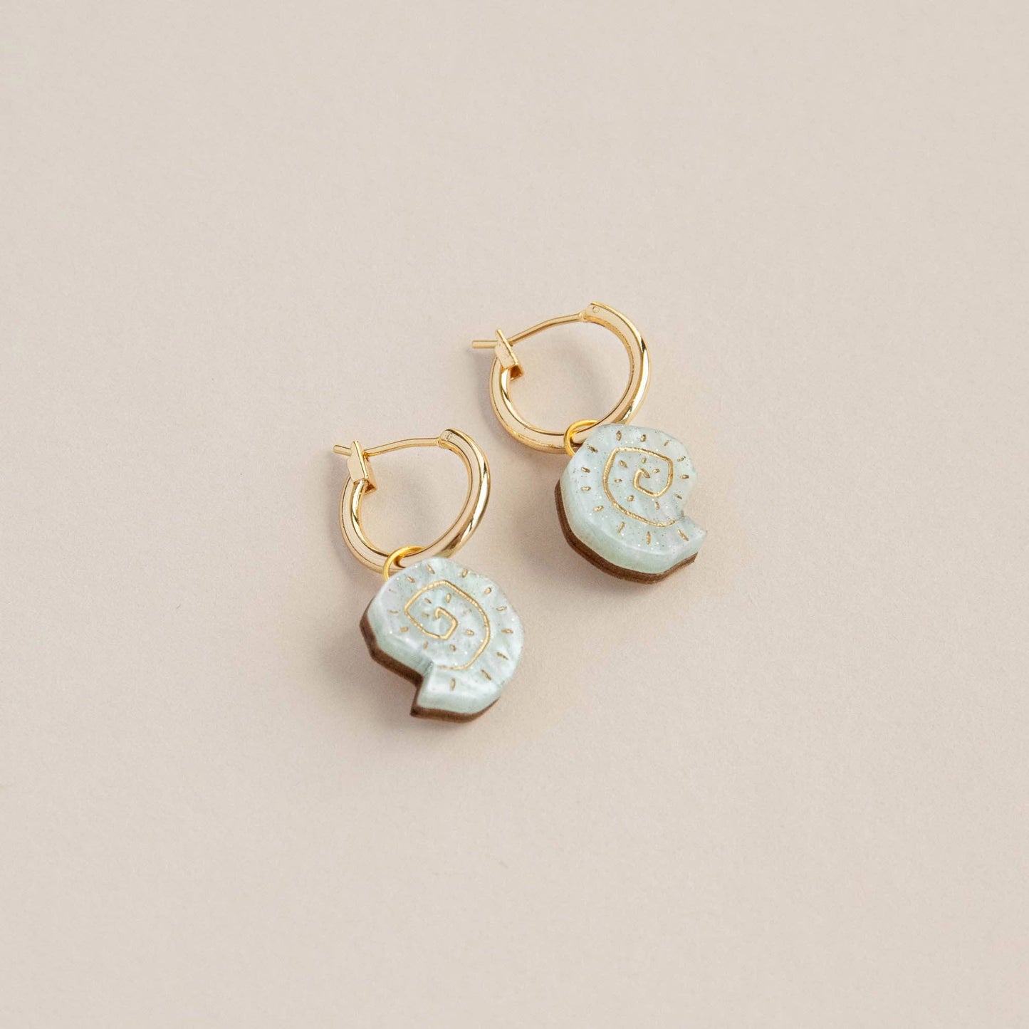 Handcrafted shell earrings on recycled paper presentation card