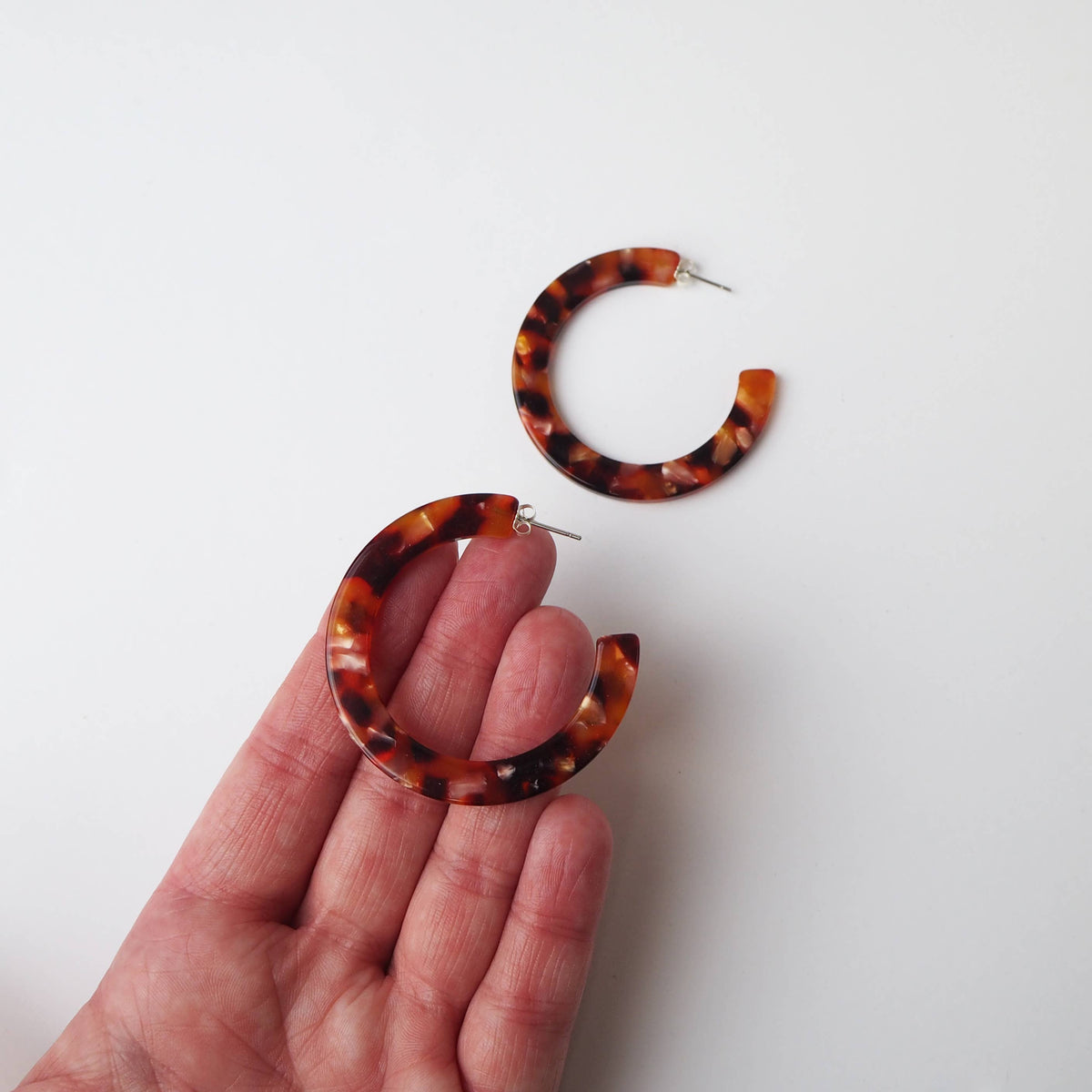 Side view of Rosa Tortoiseshell Large Statement Acetate Hoop Earrings