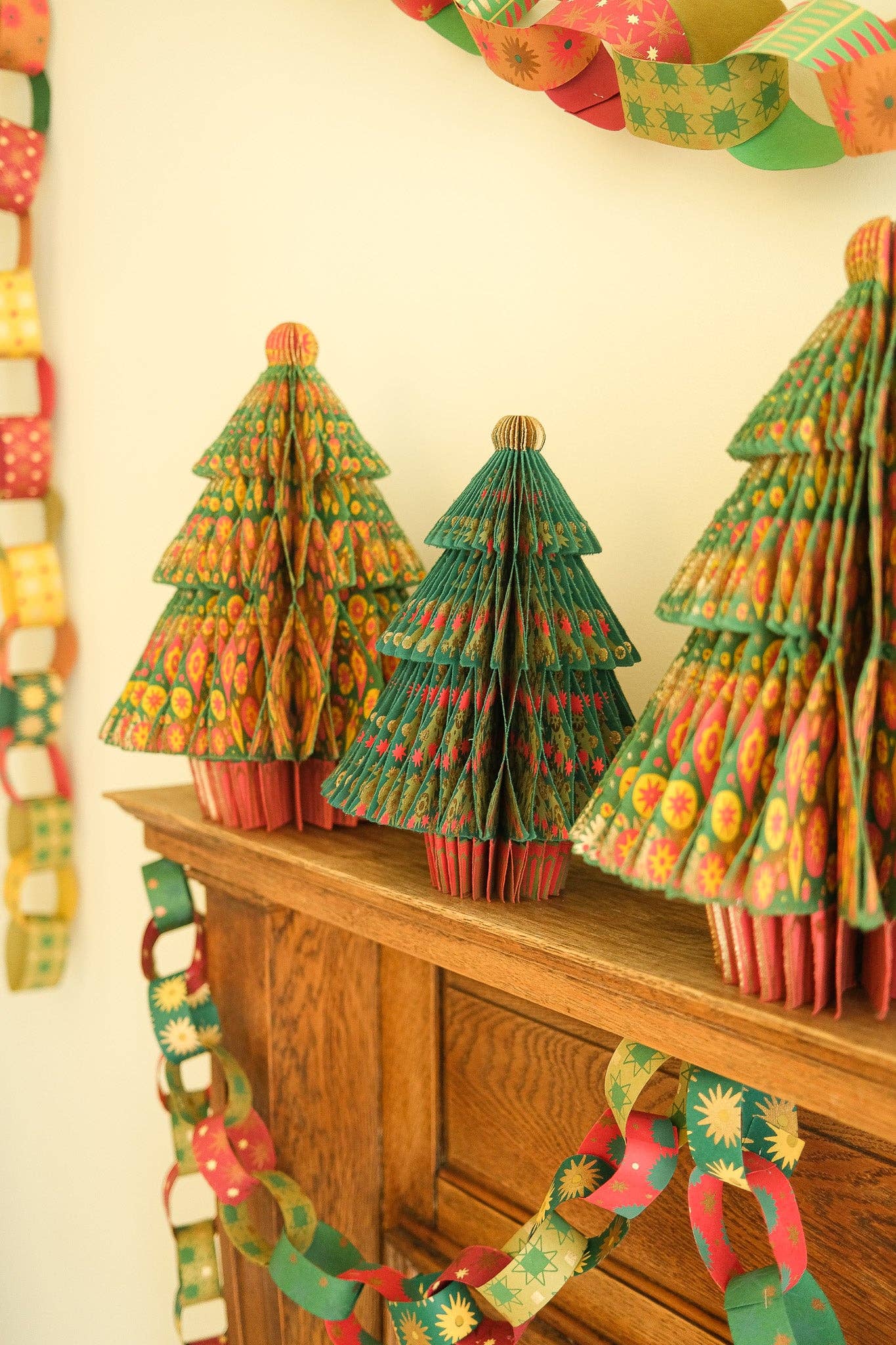 Recycled festive paper chain strips, hand-printed double-sided, eco-friendly decoration kit.