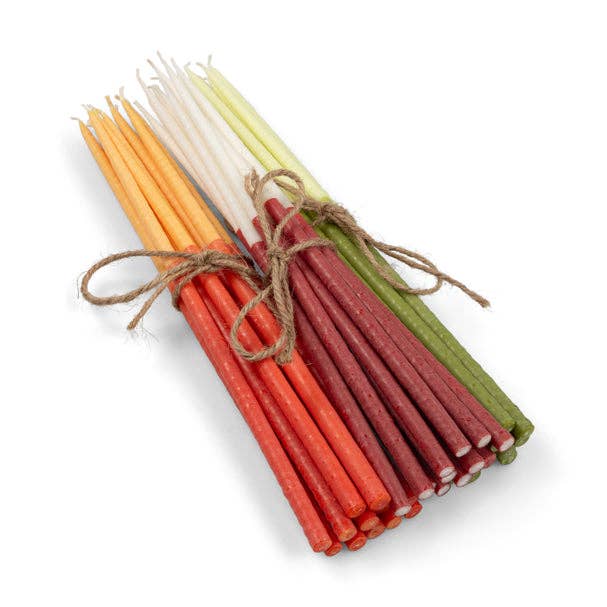 Eco-friendly two-tone dinner candles on a decorated table