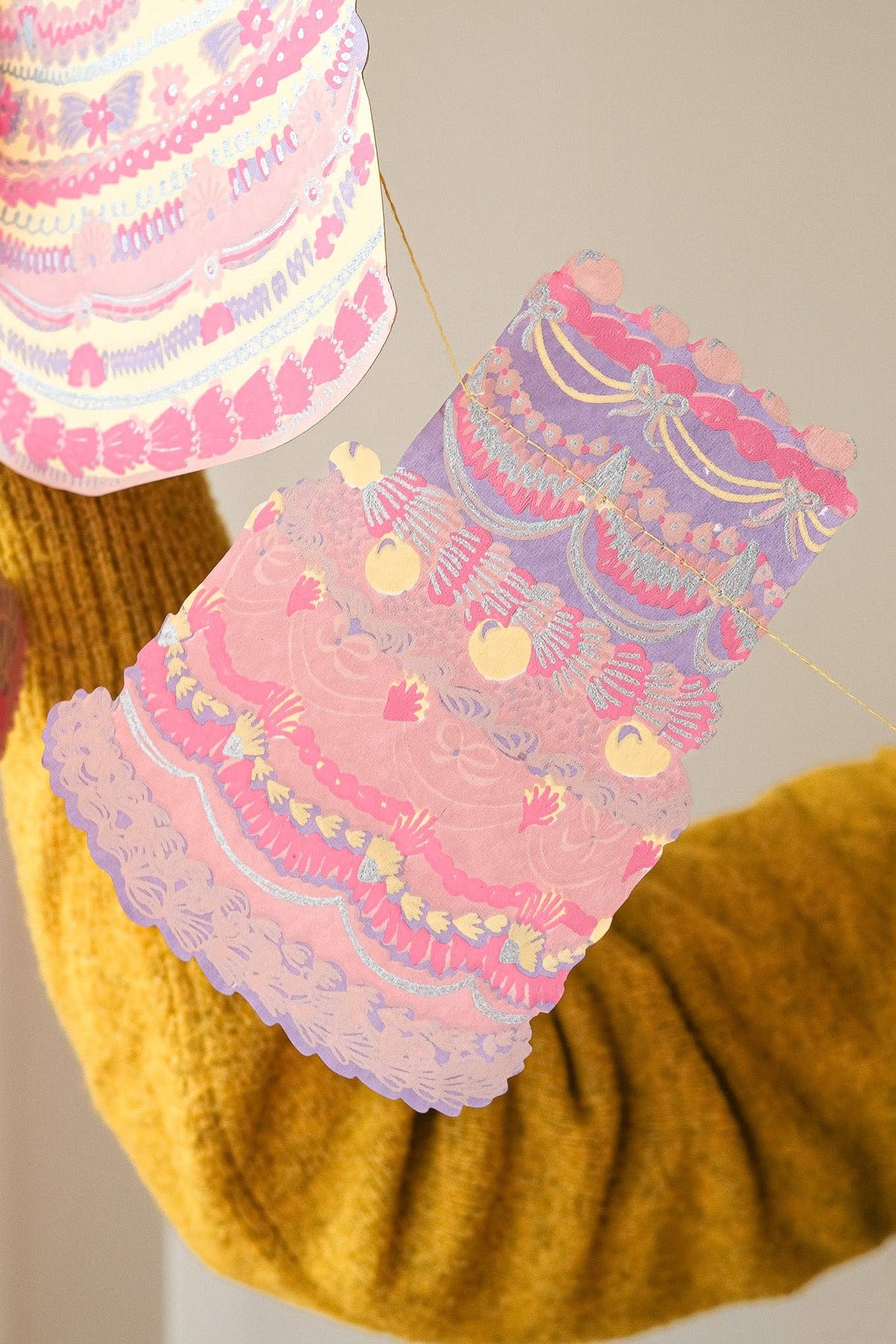 Handmade cake illustrations on sewn party garland