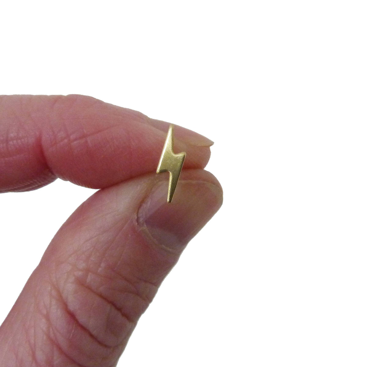 Close up of gold lightning bolt studs with sterling silver posts
