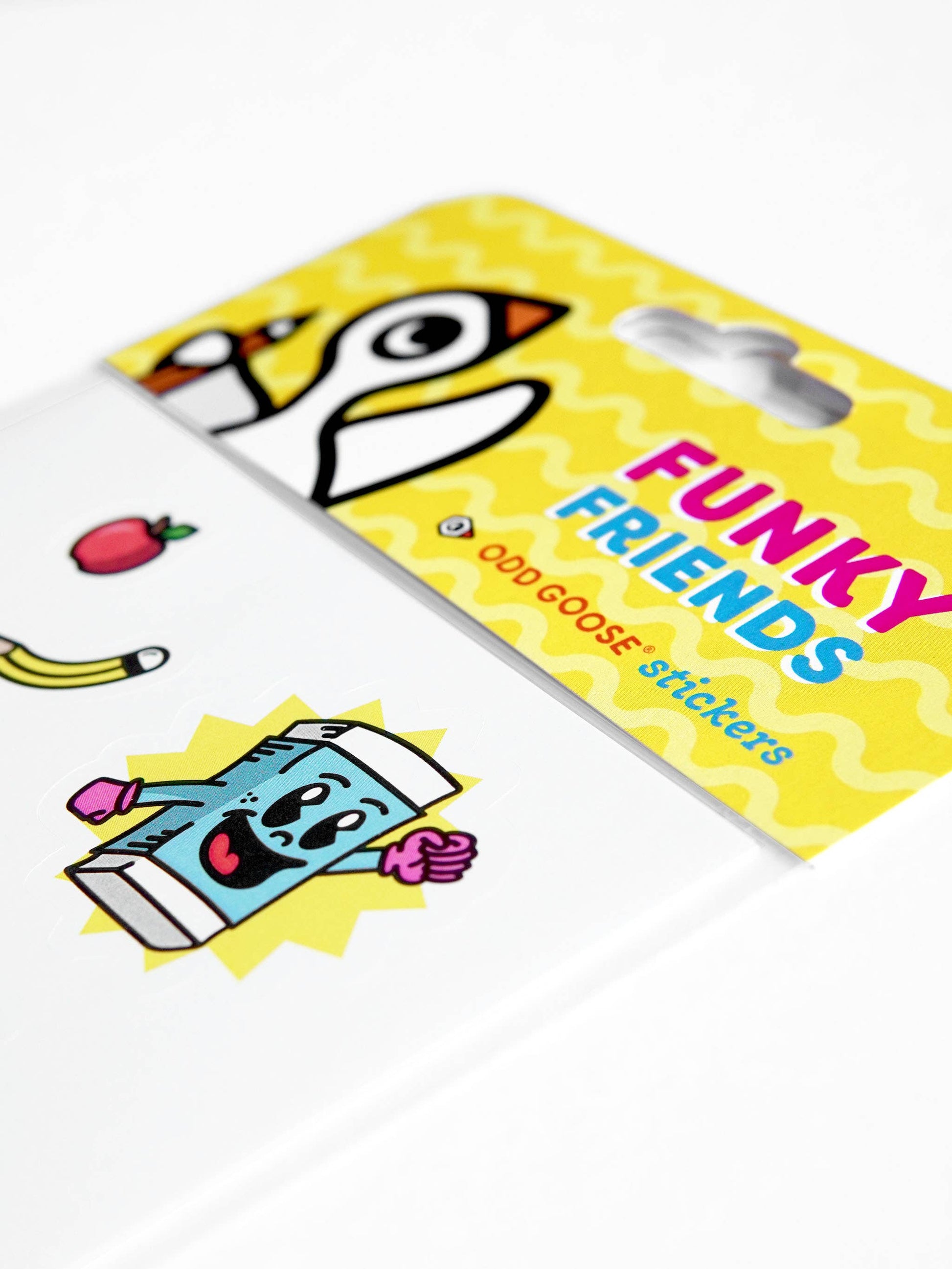 Close up of colourful hand-drawn stickers including fruit and characters
