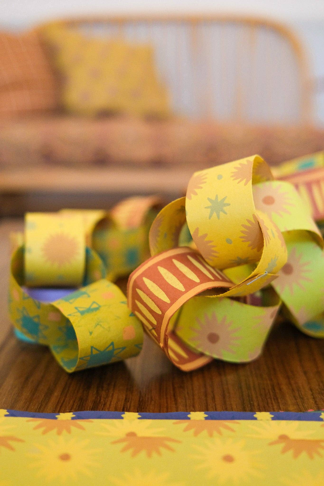 Detailed view of hand-printed green paper chain pattern
