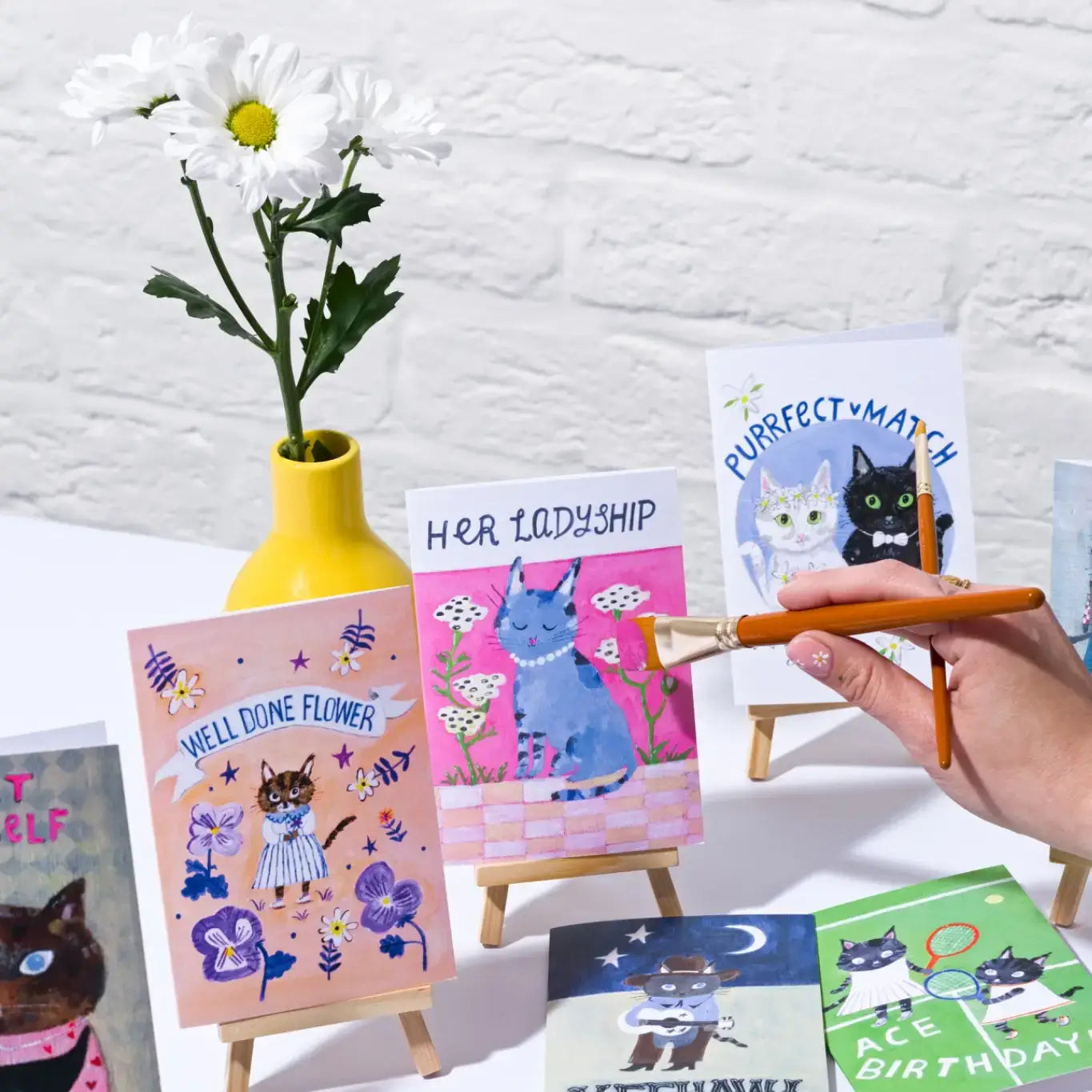 Playful cat illustration on eco-friendly greetings card