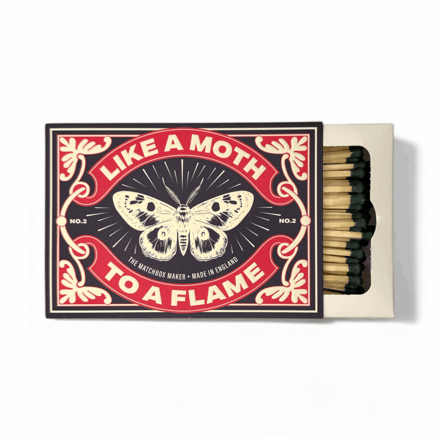 Luxury 'Moth To A Flame' long matchbox on a mantlepiece, close-up showing elegant design and extra-long matches