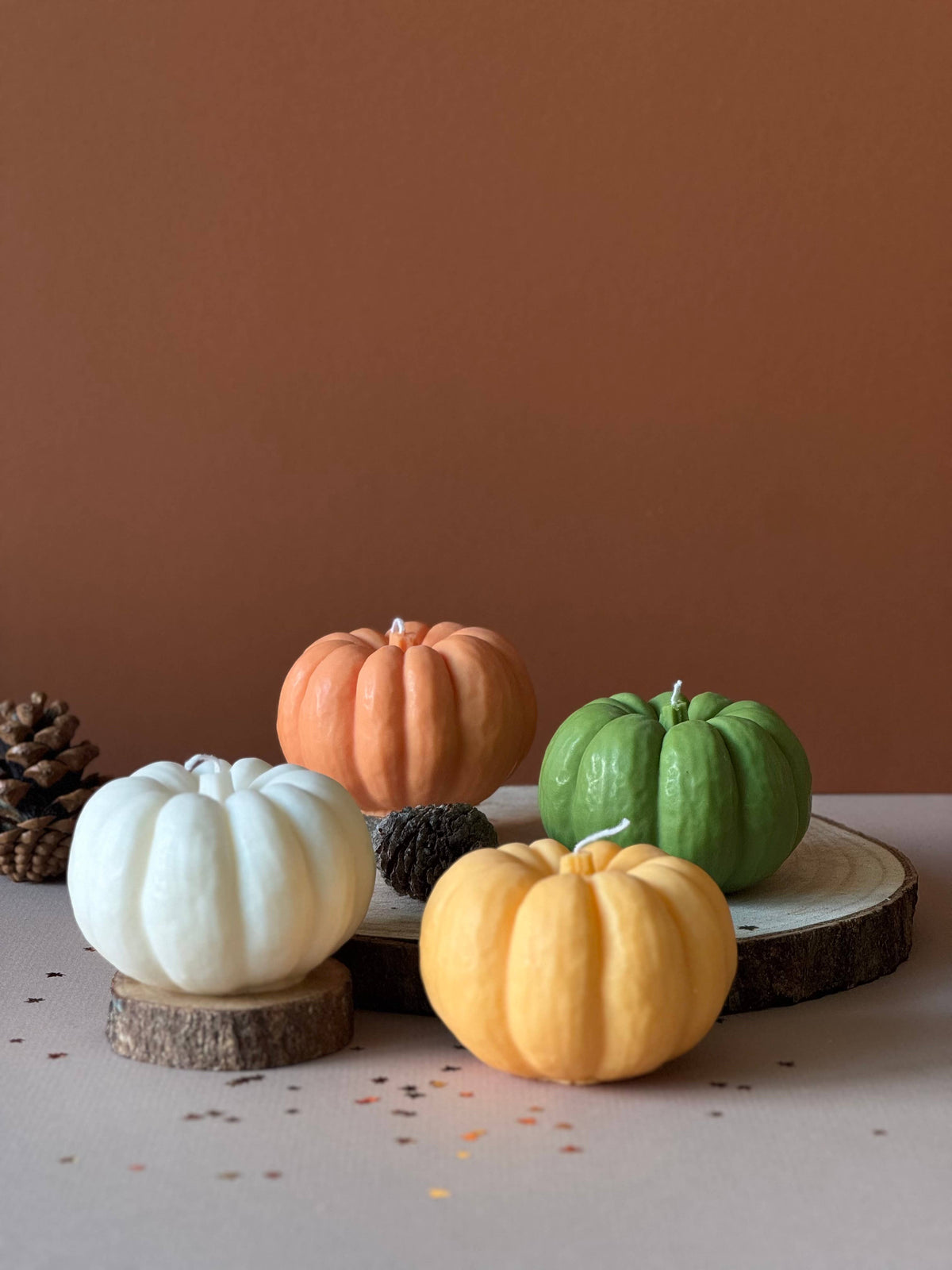 Group of autumn pumpkin candles on a display
