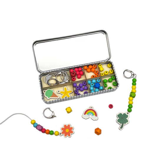 The Lucky Dip Keyring making kit is a wonderful plastic free activity. It offers a selection of wooden fobs to include a clover, flower, starfish, ice cream &amp; a rainbow, allowing children to create 5 keyrings. The kit also comes with rainbow coloured spacer &amp; geometric beads to complement the showpiece beads for vibrant accessories!