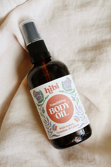 Applying Nourishing Body Oil to damp skin