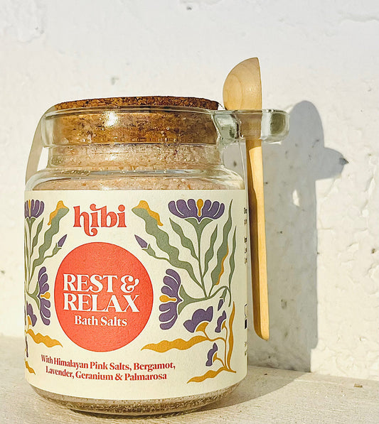 Rest and Relax Himalayan Pink Bath Salts in glass jar with wooden spoon