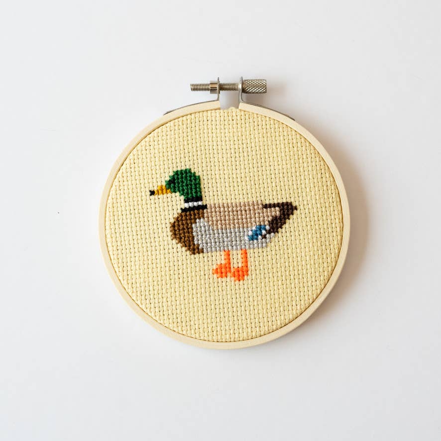 Finished duck cross stitch in its 11cm wooden hoop