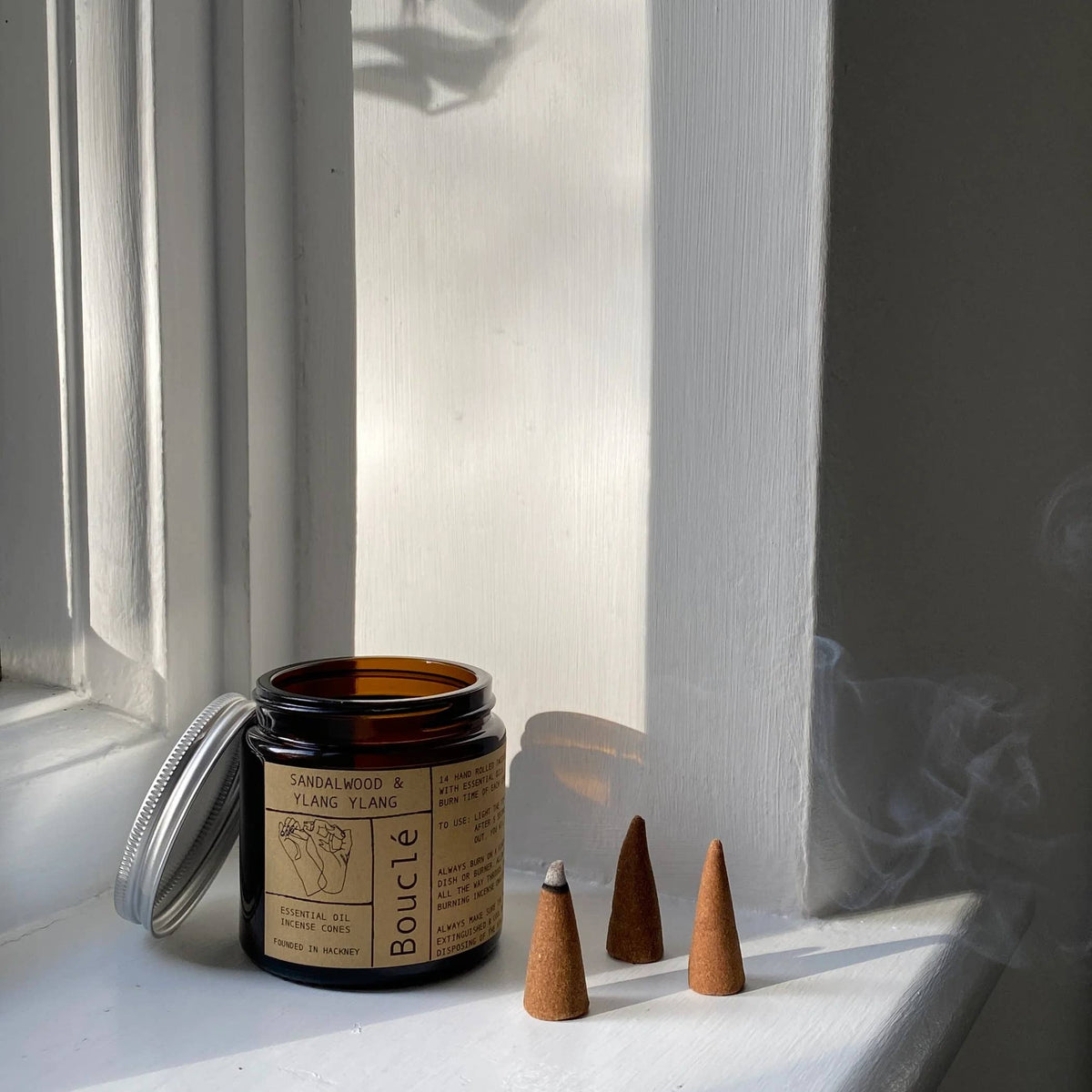 Rose and Bergamot incense cones in an apothecary amber glass jar