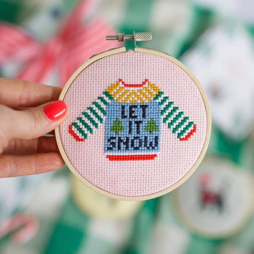 Completed Let It Snow Christmas jumper cross stitch design in a 4-inch bamboo hoop