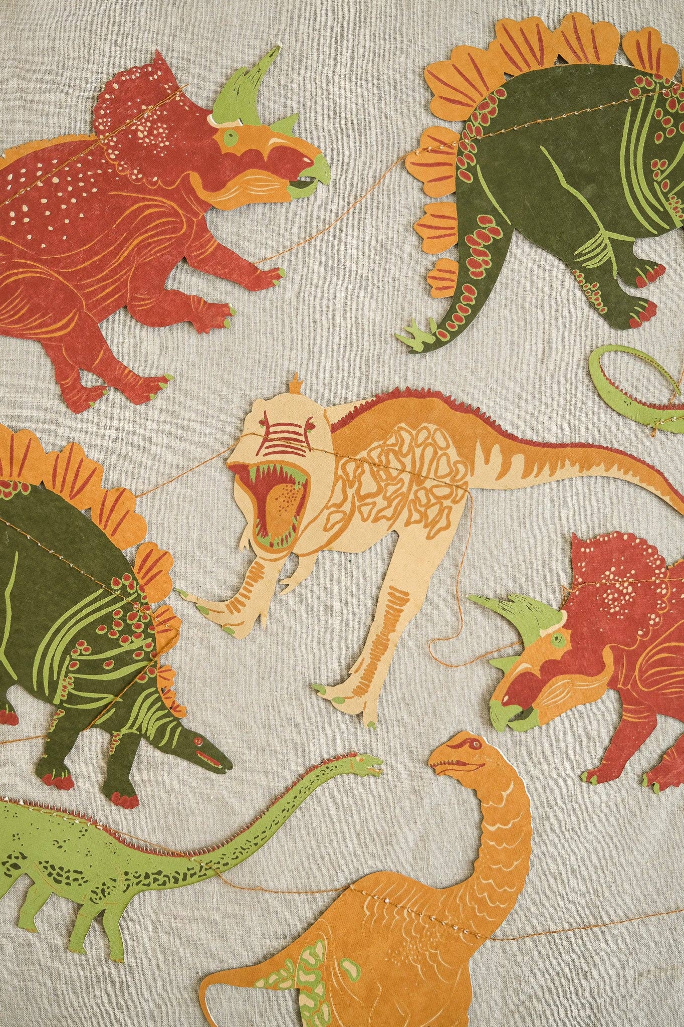 East End Press Dinosaur Garland with 10 colourful hand-printed dinosaurs on recycled paper, 3 metres long