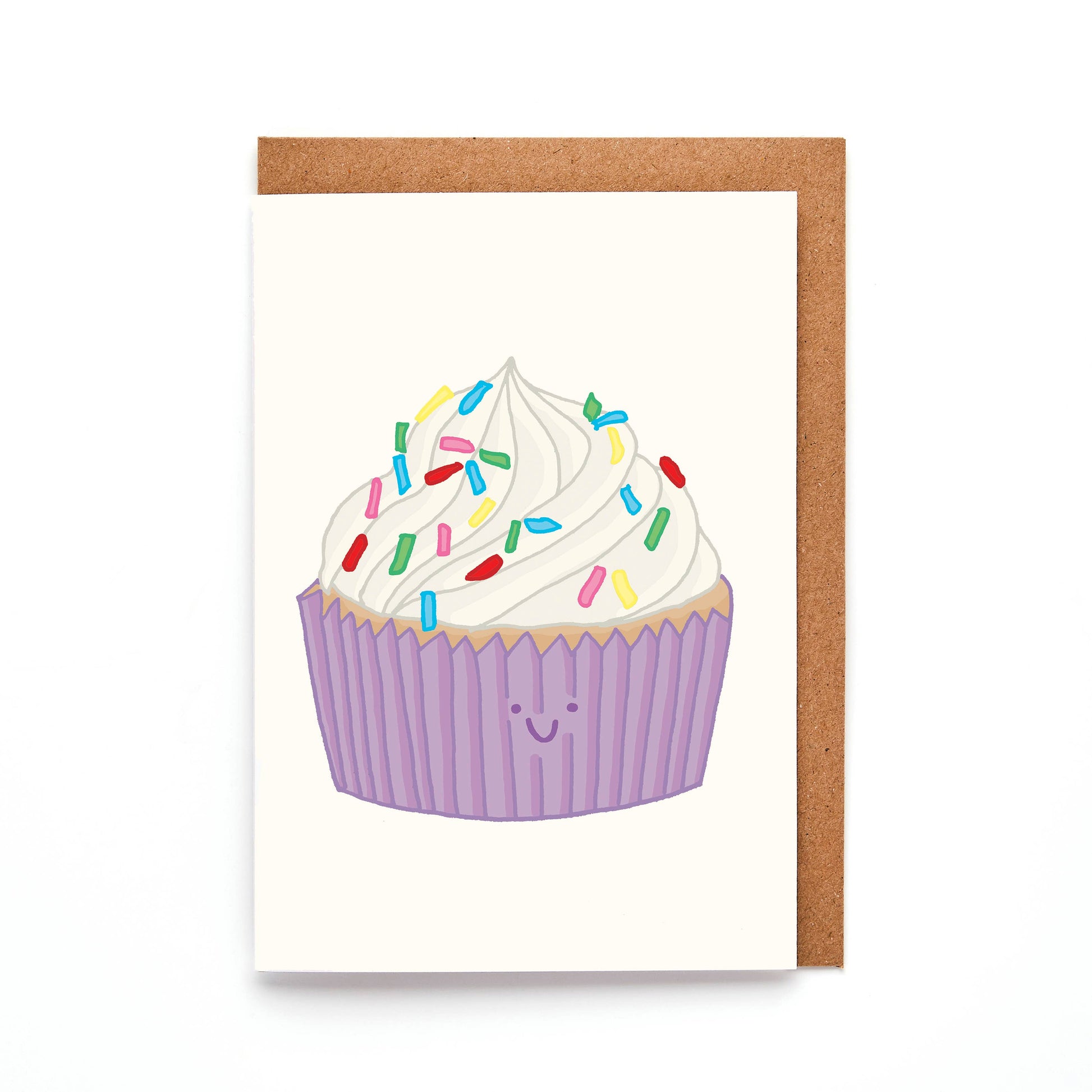 A Mini Cupcake Card with an illustration of a smiling cupcake with colourful sprinkles on top, presented in a purple cupcake. case. Made in the UK You've Got Pen on Your Face.
