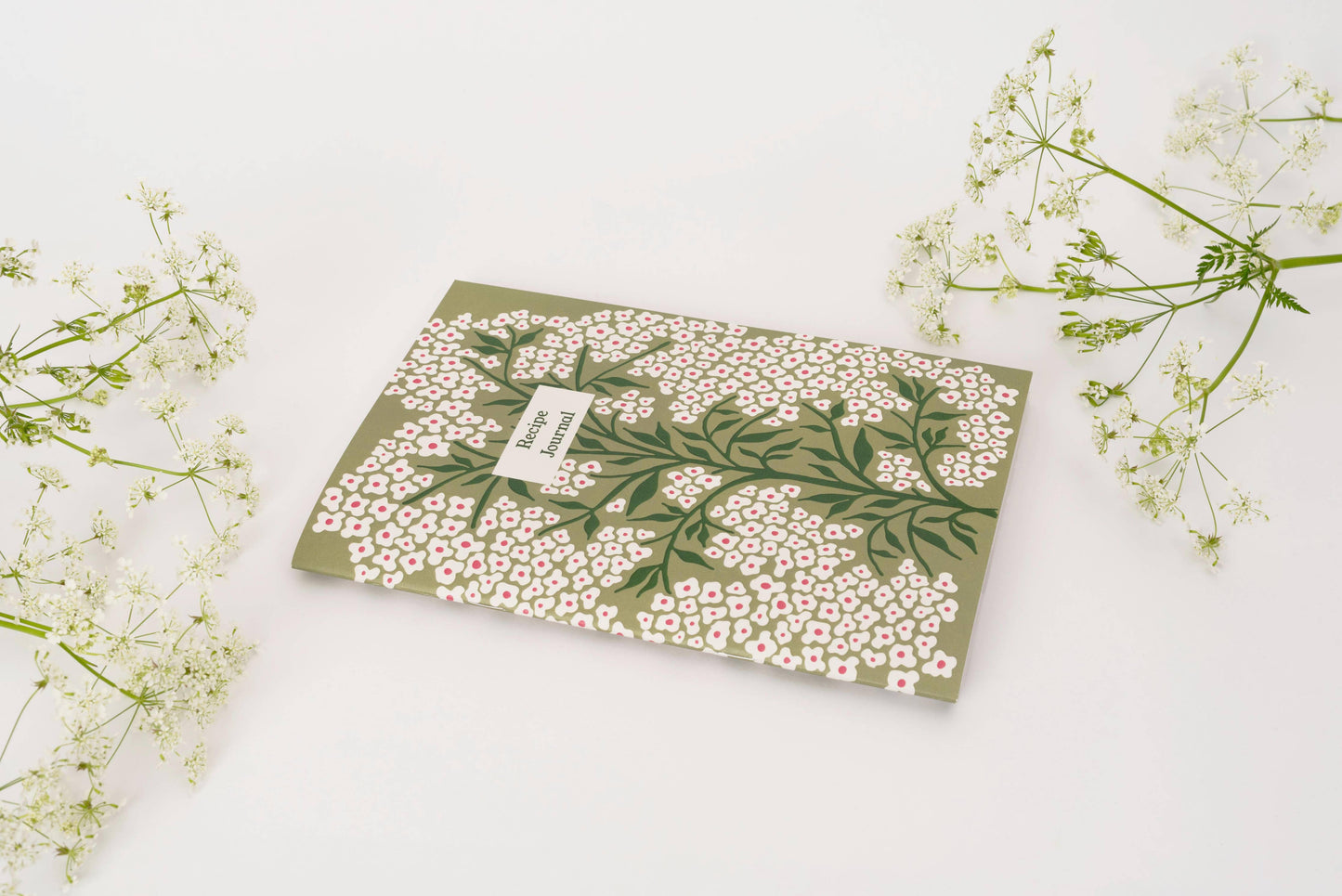 Pages are designed to layout ingredients and method as well as space to draw pictures, staple photos etc. Also includes a namesake page and handy weights and measurements page at the back. Supplied with Bookmark.