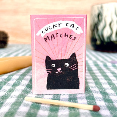 Safety matches in an original matchbox design, made from 100% recycled card. Featuring a cute black cat and the words Lucky Cat Matches.

Makes a lovely little gift, to wish someone good luck or to light those birthday candles.