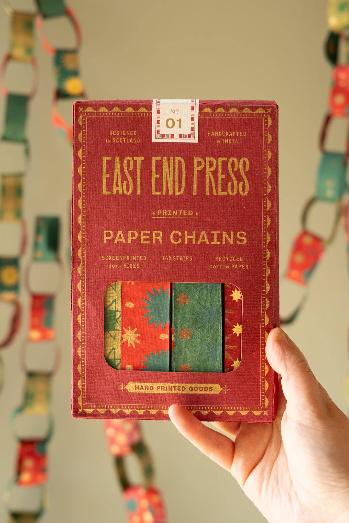 Recycled festive paper chain strips, hand-printed double-sided, eco-friendly decoration kit.