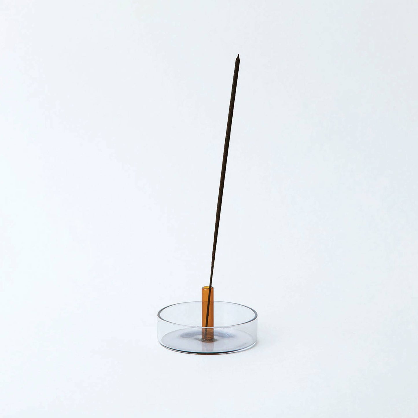 Duo Tone Glass Incense Holder with burning incense, smoke gently rising