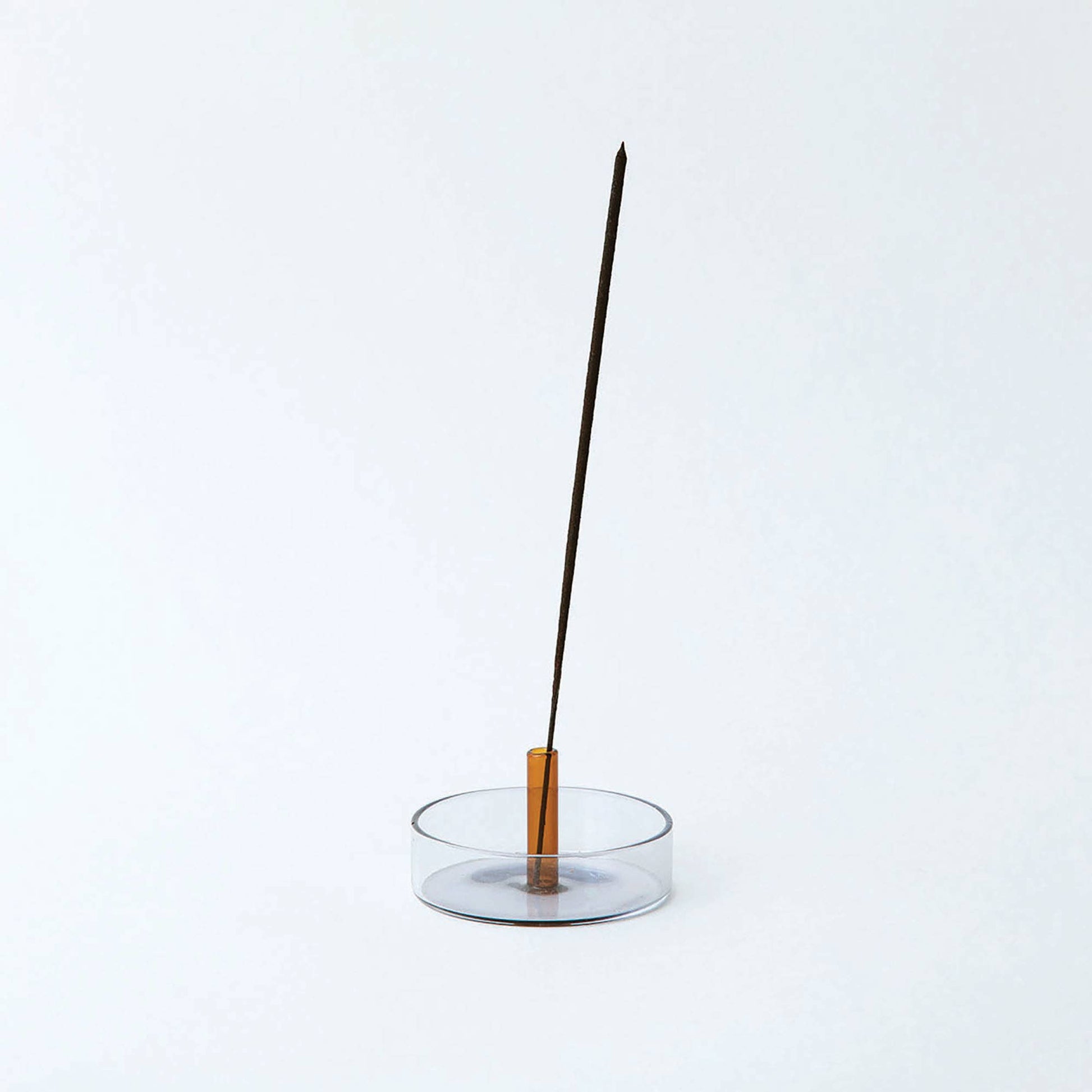 Duo Tone Glass Incense Holder with burning incense, smoke gently rising