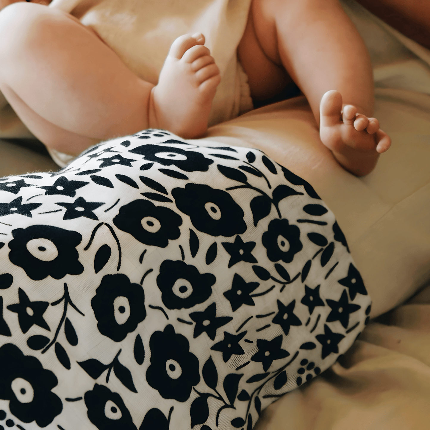 Close‑up of Fairford Shadow Liberty print muslin showing high‑contrast floral pattern designed for newborn visual development.