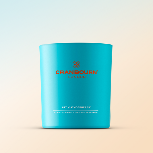 Sunset in Ibiza™ has citrus top notes, including mandarin, blood orange and bergamot with a heart of neroli and jasmine, resting on a base of cedarwood. A hedonistic citrus scent evoking a long summer’s evening and reminiscent of the iconic Balearic island. Scented Candle made with Essential Oils/ Sustainable Natural Vegetable &amp; Bees Wax Blend.

Handmade in the UK. Blue handmade glass vessel.