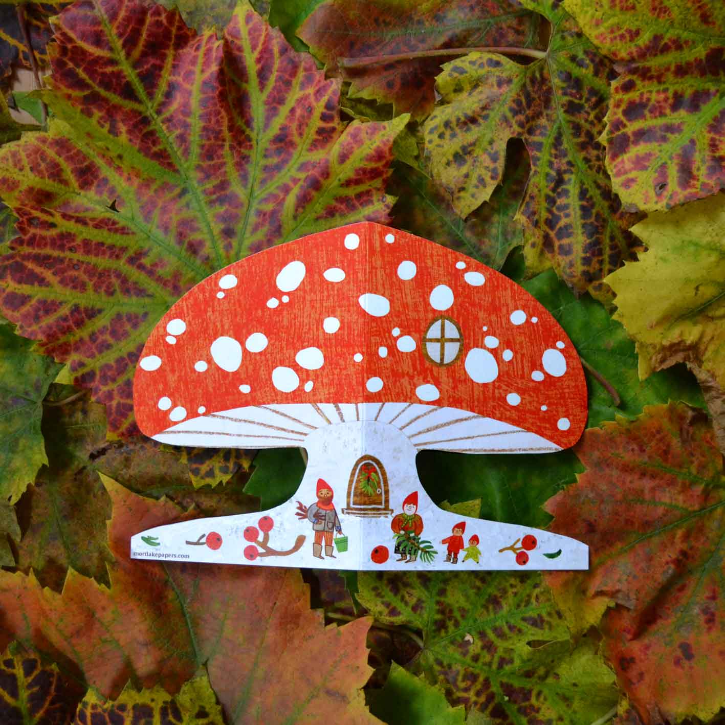 Close-up of Snowy Mushroom Christmas Card, die-cut toadstool shape