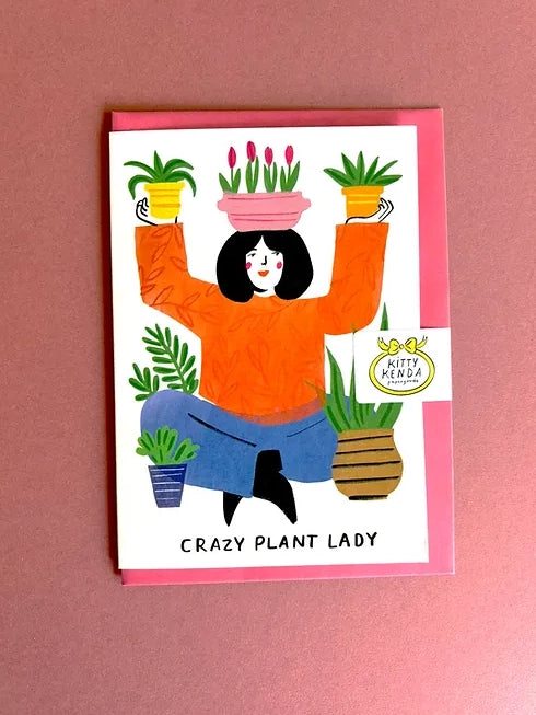  illustrated card showcasing a plant-juggling enthusiast surrounded by her leafy companions. This cheeky design celebrates that friend who can't stop adding to their green collection! Ideal for the person whose home has transformed into an urban jungle.