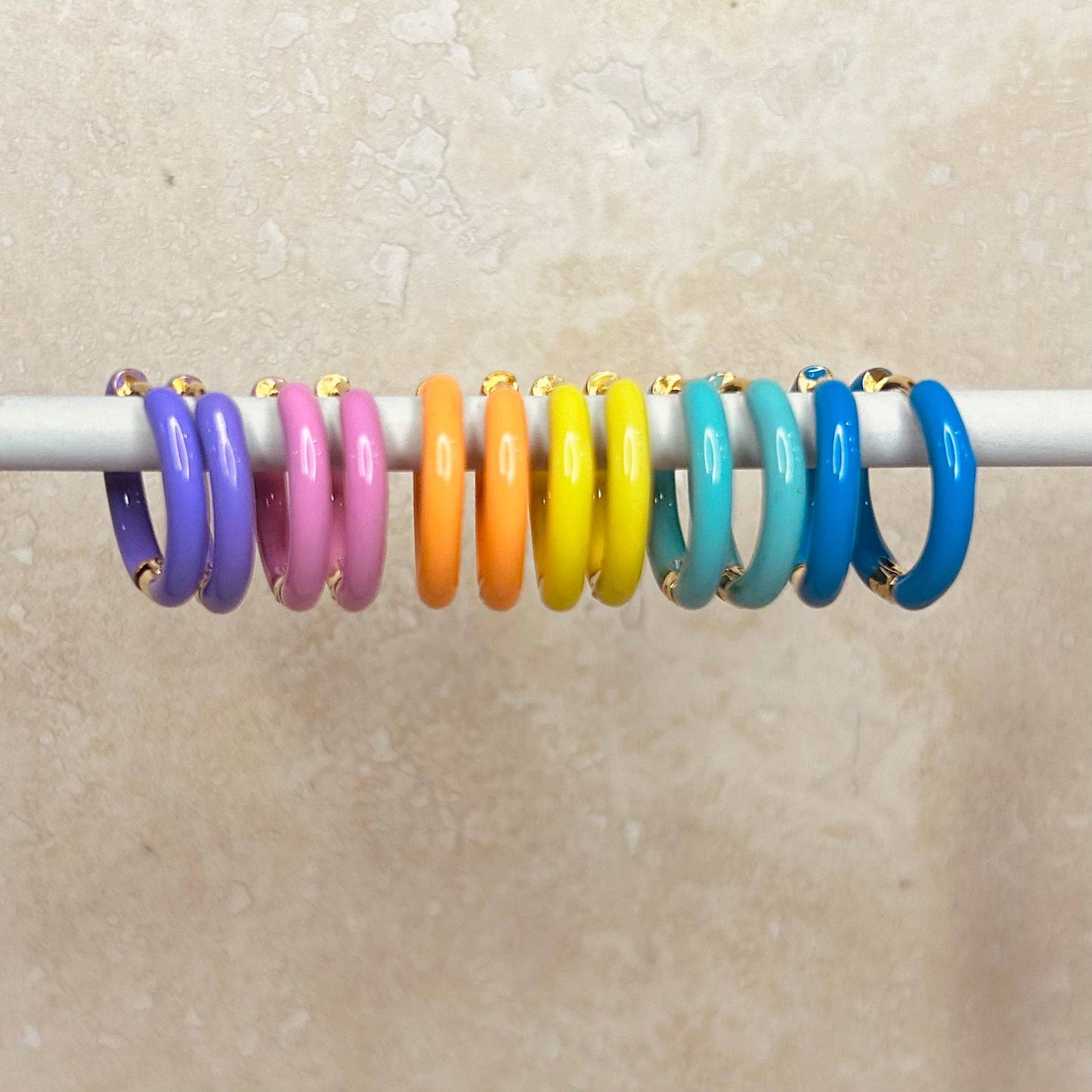 Candy Enamel Hoops, with gold plated fixings. 6 colours available, blue, green, yellow, orange, pink, lilac. 17mm wide with comfortable hinge click fastening 
