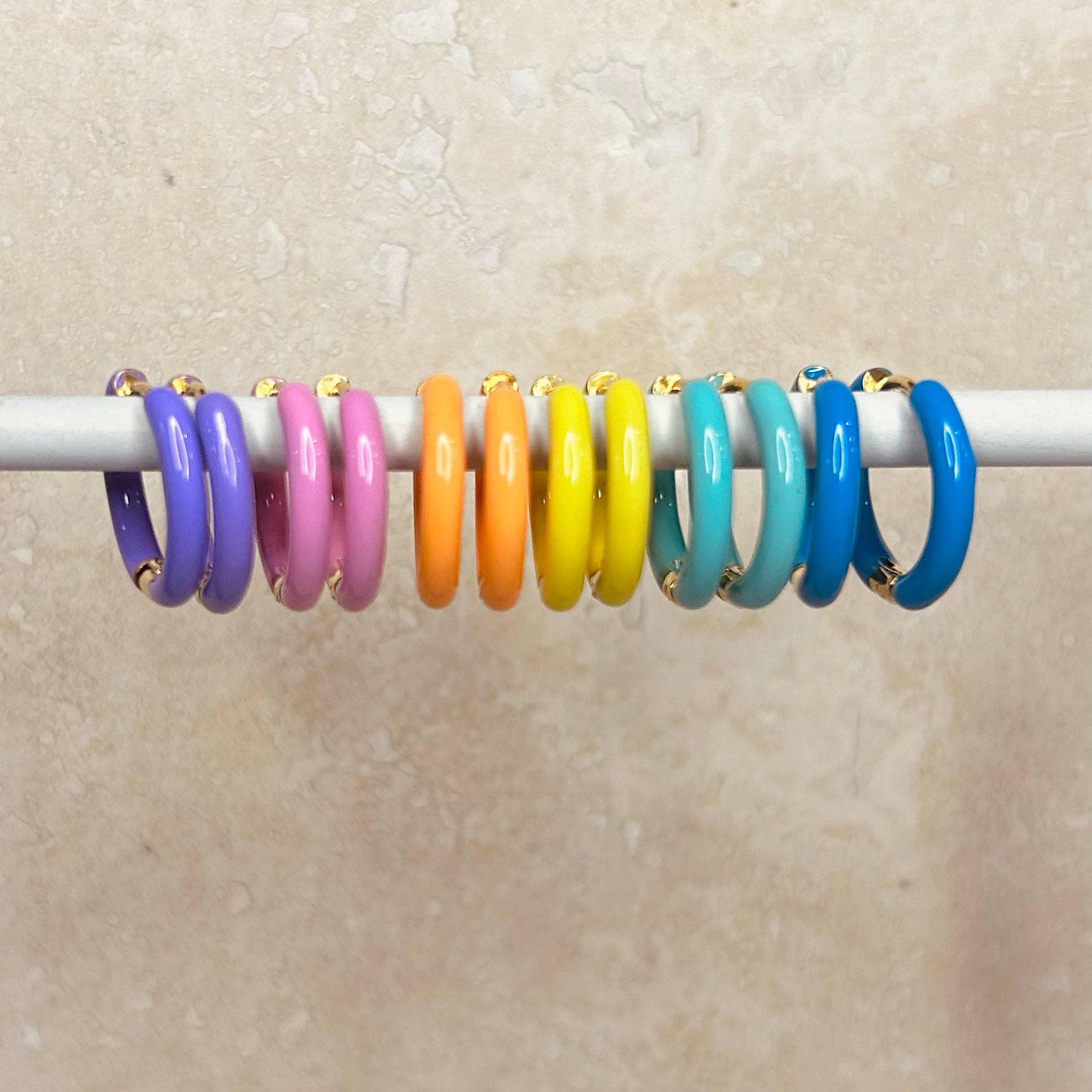 Candy Enamel Hoops, with gold plated fixings. 6 colours available, blue, green, yellow, orange, pink, lilac. 17mm wide with comfortable hinge click fastening 