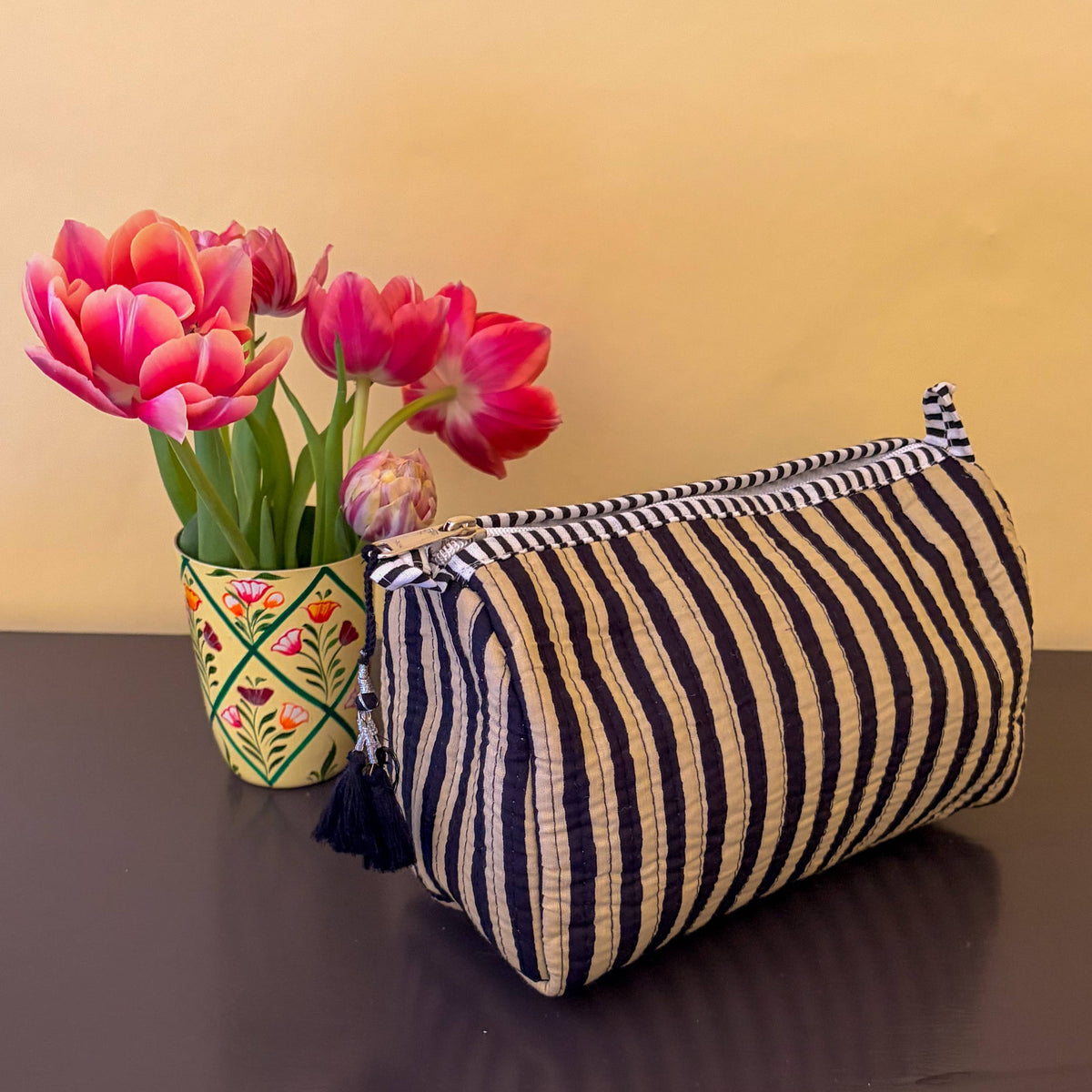 Black and taupe thin stripe block-printed cosmetic bag with waterproof lining