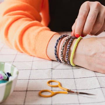 Stack of finished handmade friendship bracelets