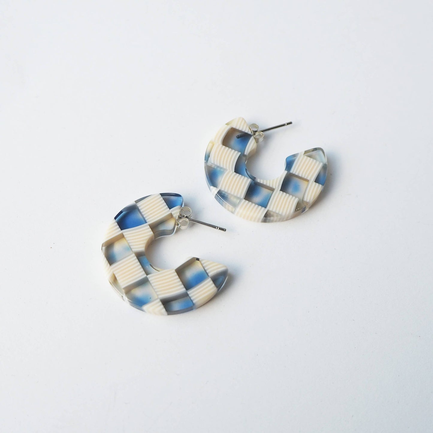 Side view of chunky ocean mix checker hoop earrings