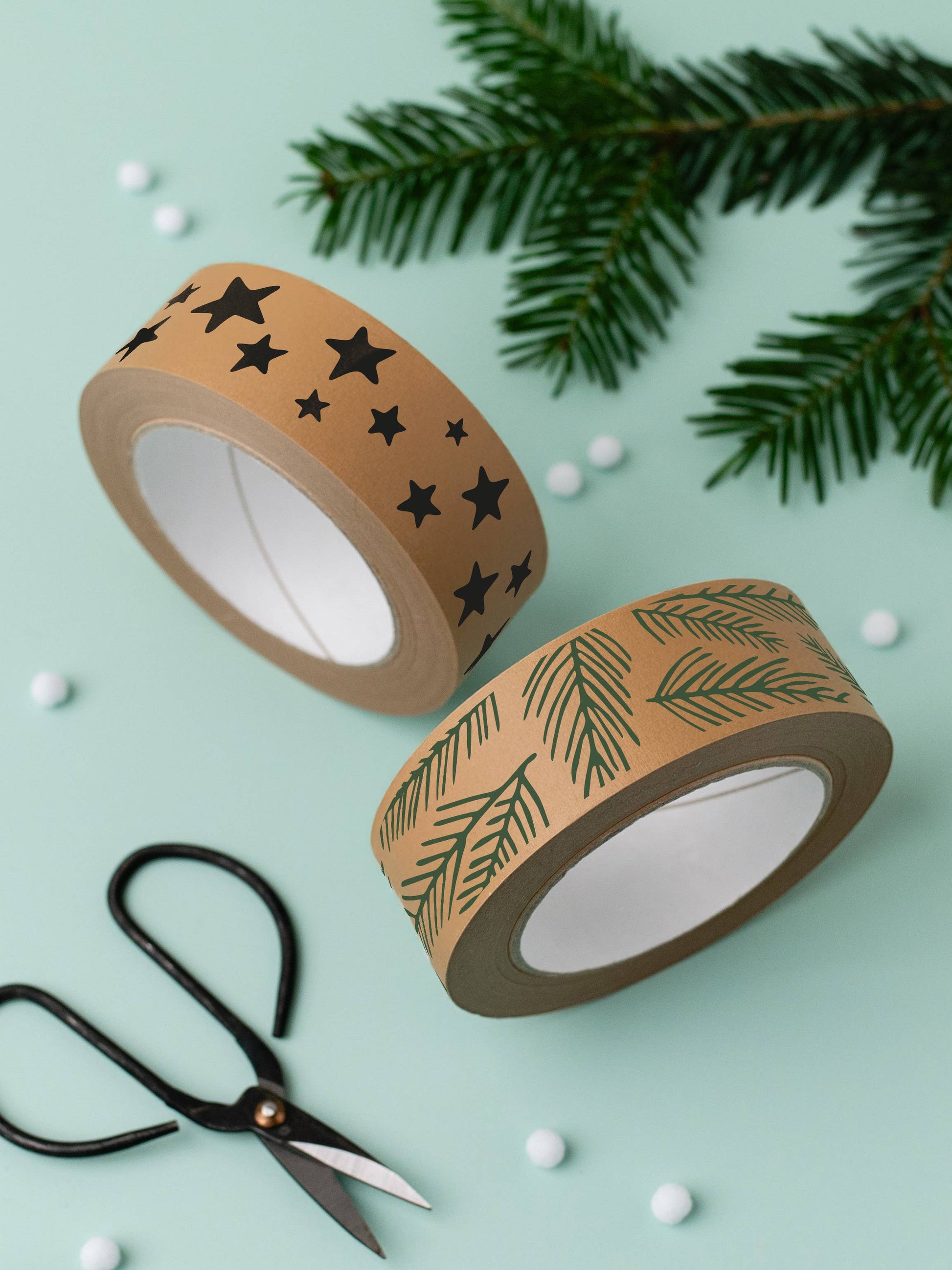 Hand tearing star pattern eco paper tape, demonstrating easy plastic-free application