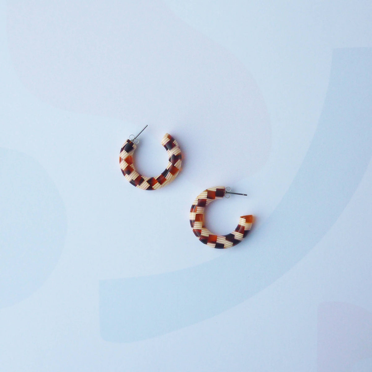 Honey checker earrings highlighting surgical steel posts