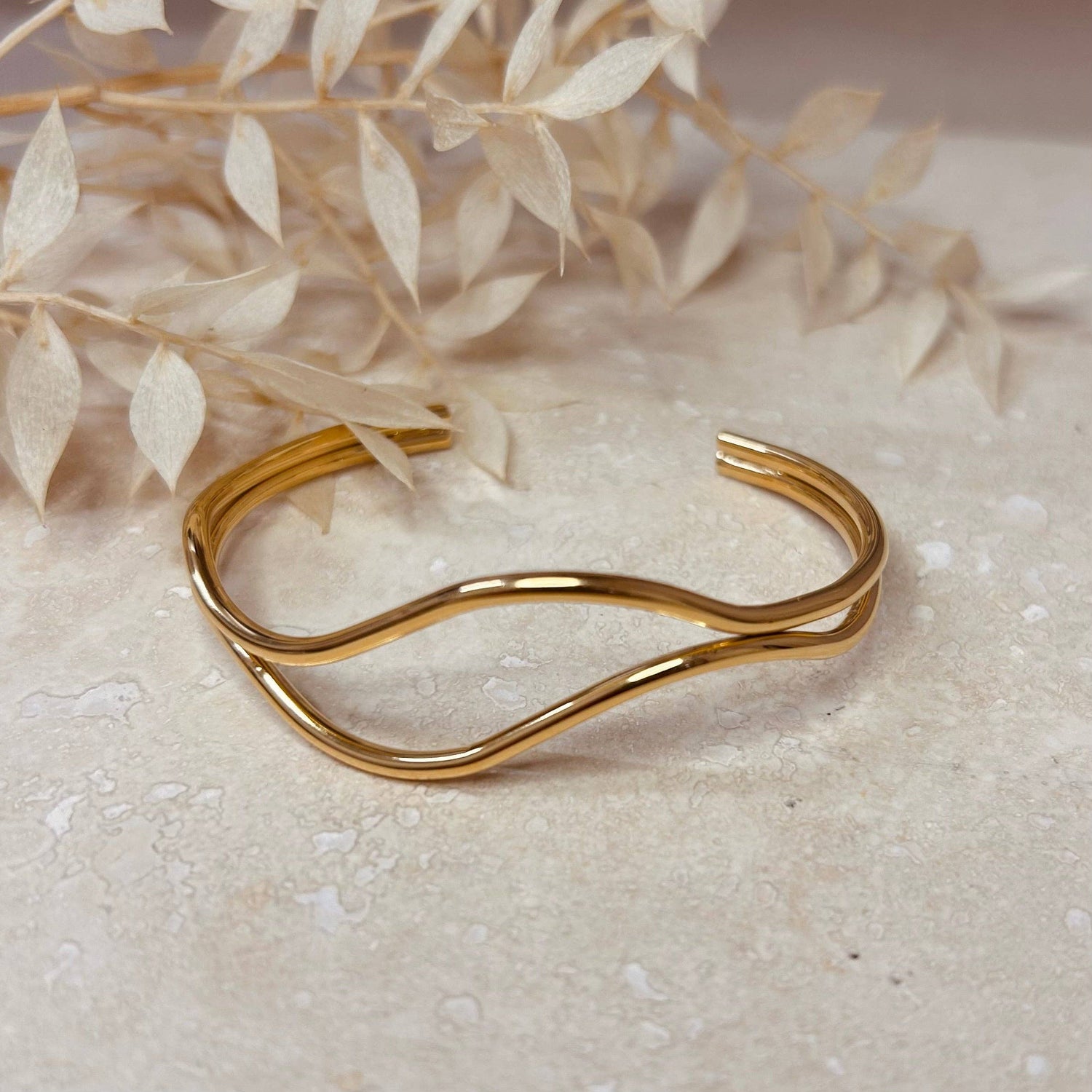 18k gold plated abstract bangle, close-up, polished finish