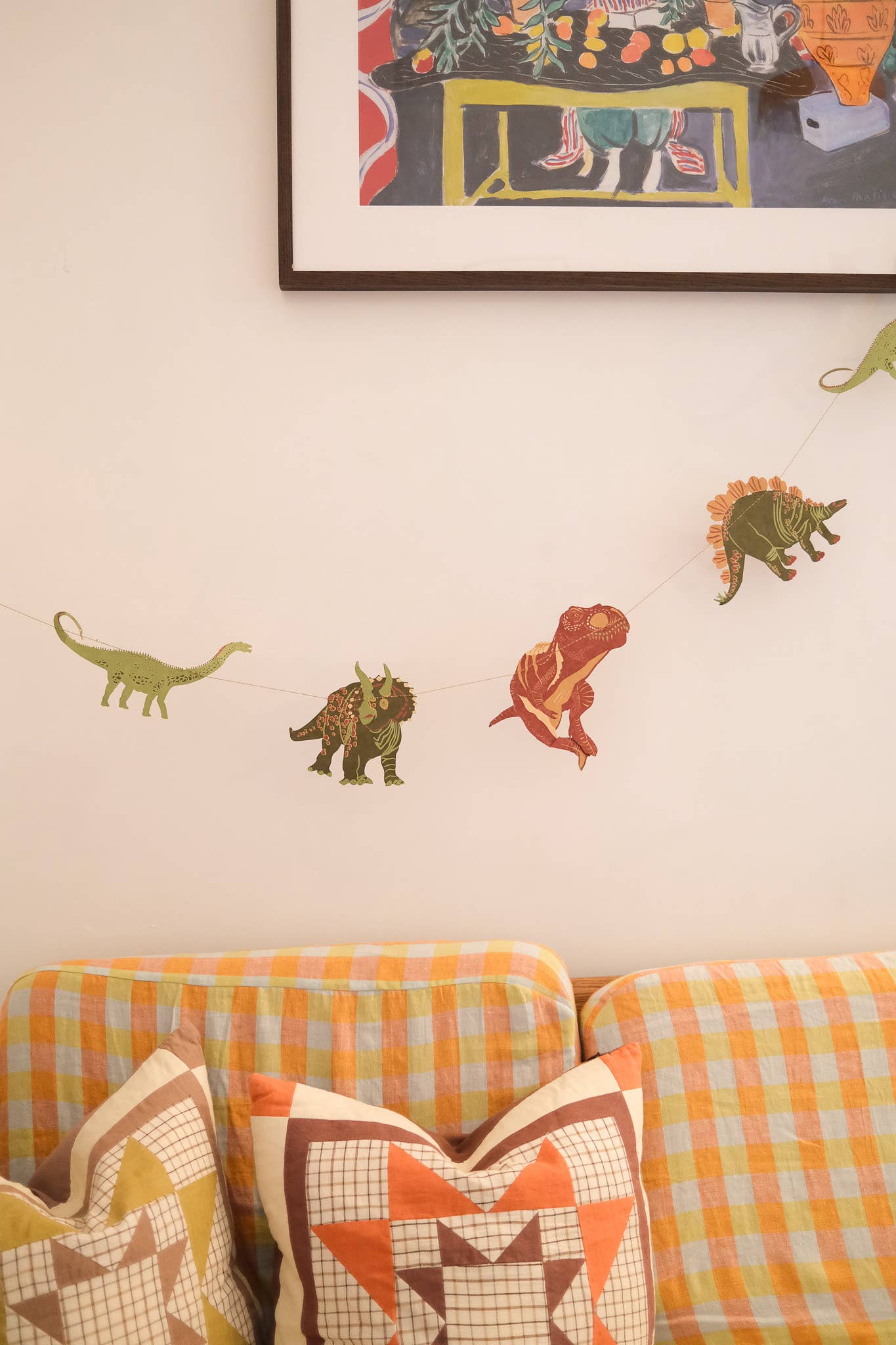 East End Press Dinosaur Garland with 10 colourful hand-printed dinosaurs on recycled paper, 3 metres long.