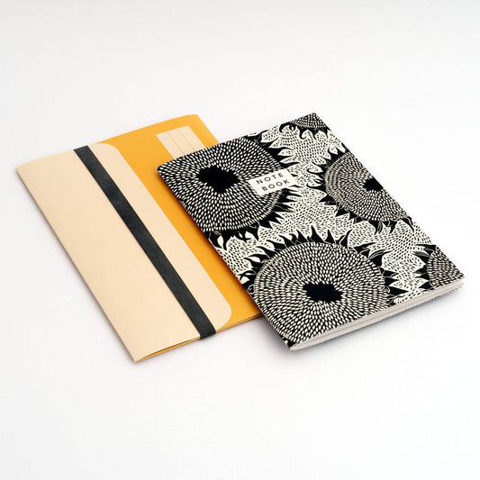 A5 Sunflower Notebook and Folder set on a neutral background