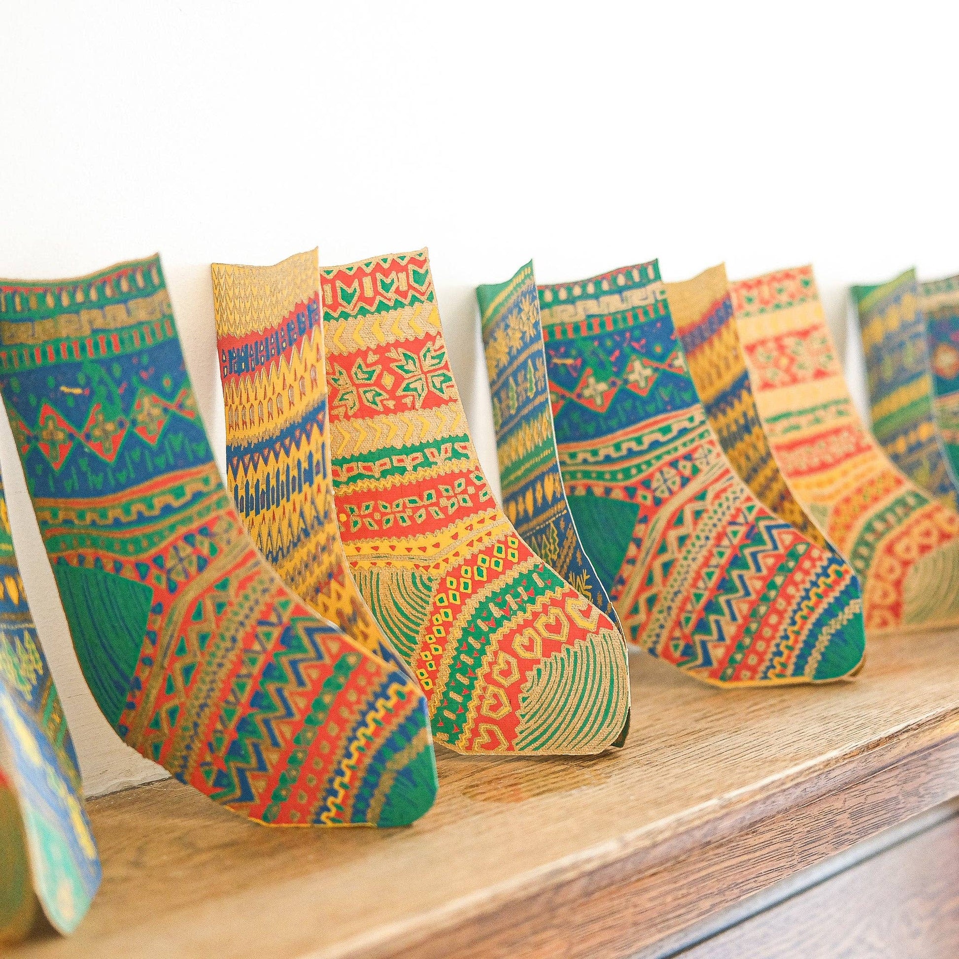 Artisan-crafted recycled paper stockings garland, eco-friendly