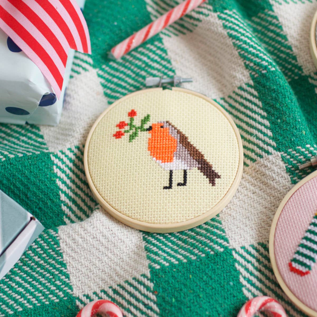 Completed Robin and Berry cross stitch design in a 4-inch bamboo hoop
