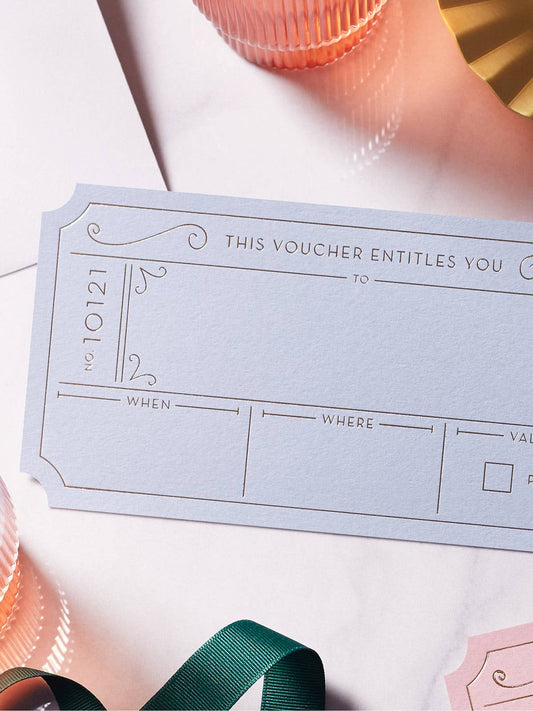 Set of three luxury hot foil golden vouchers with light grey DL envelopes, ideal for unique experience gifts.