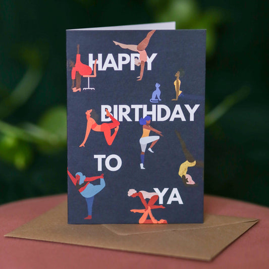 Navy A6 birthday card featuring women doing yoga and gymnastics poses
