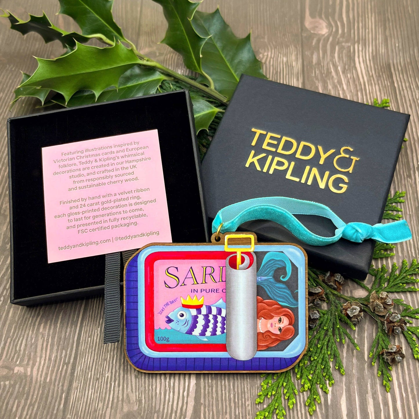 Sardine Tin Mermaid wooden Christmas tree decoration with Teddy & Kipling illustration, sustainably certified cherry wood, gold-plated ring, and turquoise velvet ribbon