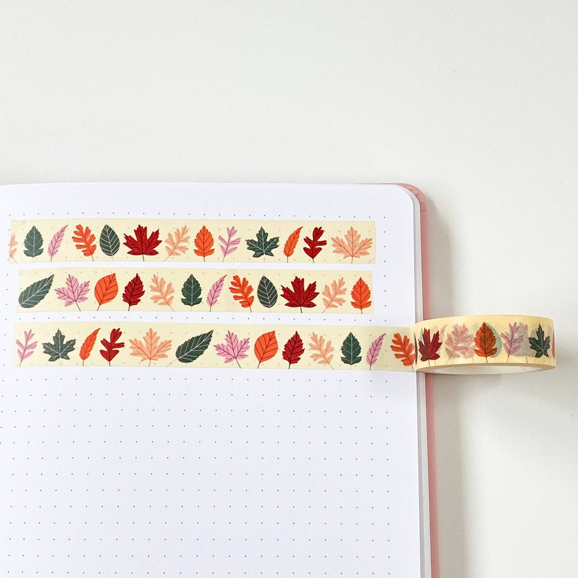 Autumn Leaves Washi Tape by Sarah Frances, colourful leaves on cream background, 15mm x 10m eco-friendly craft tape.