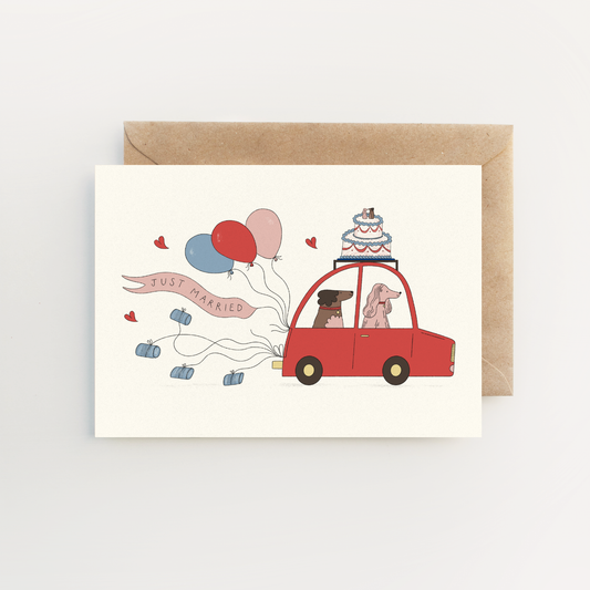 Just Married Greetings Card by Holly Fuller, two dogs in red car illustration, sustainably sourced 300gsm plastic-free card with kraft envelope, eco-friendly wedding greeting, UK made