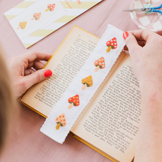 Toadstool cross stitch bookmark kit contents: Aida fabric, colourful embroidery threads