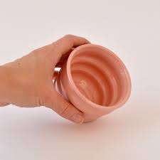 Handcrafted Ripple Beaker in Pink Handcrafted from stoneware clay, this colourful ceramic beaker with distinctive ripple texture is ideal for your morning coffee, a wine with friends or even a good old cup of water. The quirky rippled form provides a playful aesthetic whilst also being extremely ergonomic to hold, perfect for slotting your fingers comfortably into the grooves. 7 cm high and 9cm wide at the rim.
